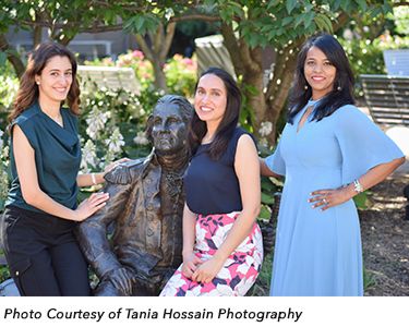 Fellows posing with statue of George Washington. Photo Courtesy of Tania Hossain Photography