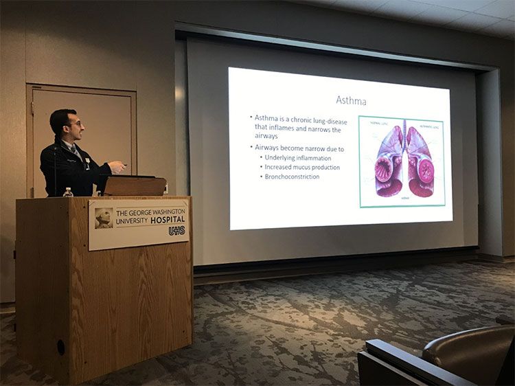 An academic fellow giving a presentation at GW Hospital